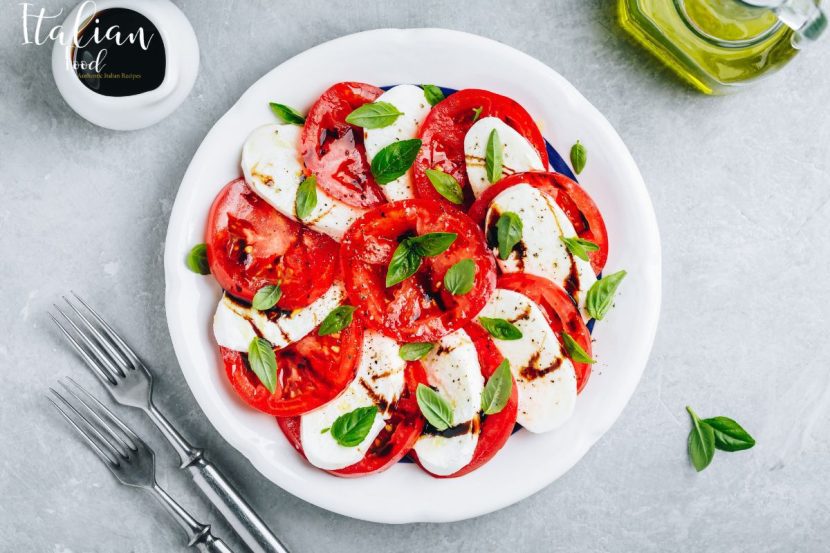 Caprese salad with fresh mozzarella, tomatoes, and basil.
