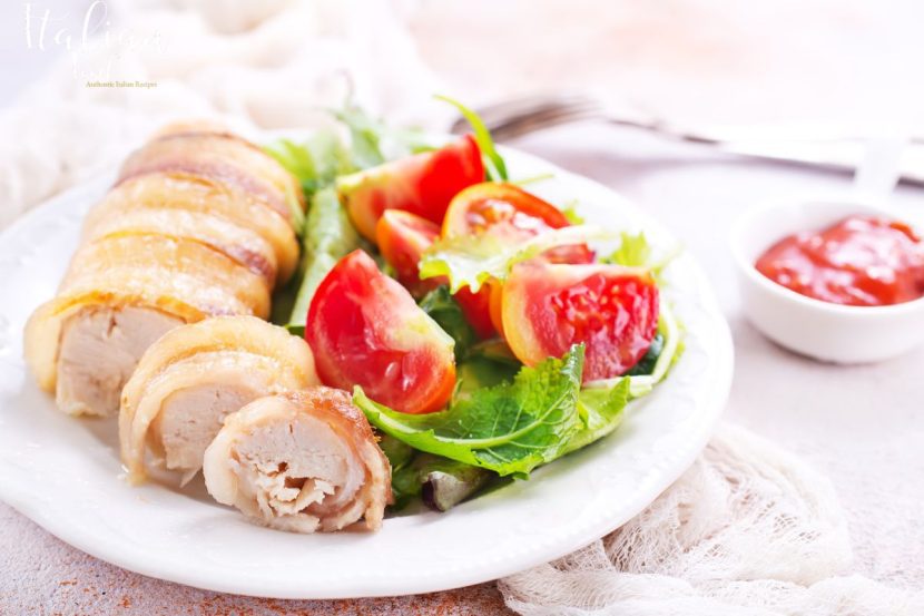 Plate of authentic Chicken Rolls (Involtini di Pollo) garnished with parsley.