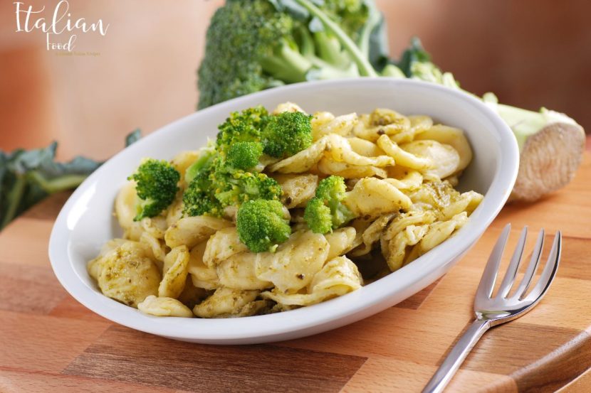 Orecchiette with broccoli rabe garnished with Parmesan cheese