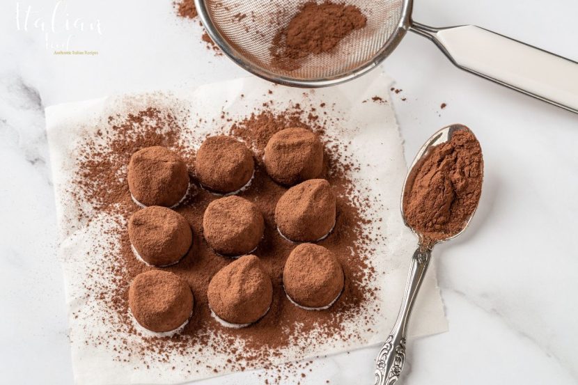 Plate of authentic Truffle Dessert with cocoa powder dusting.
