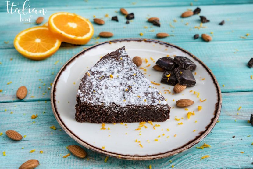 Slice of Caprese cake dusted with icing sugar