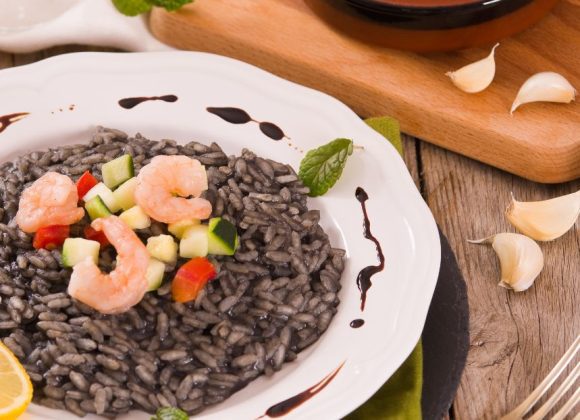 Plate of Squid Ink Risotto with chopped squid